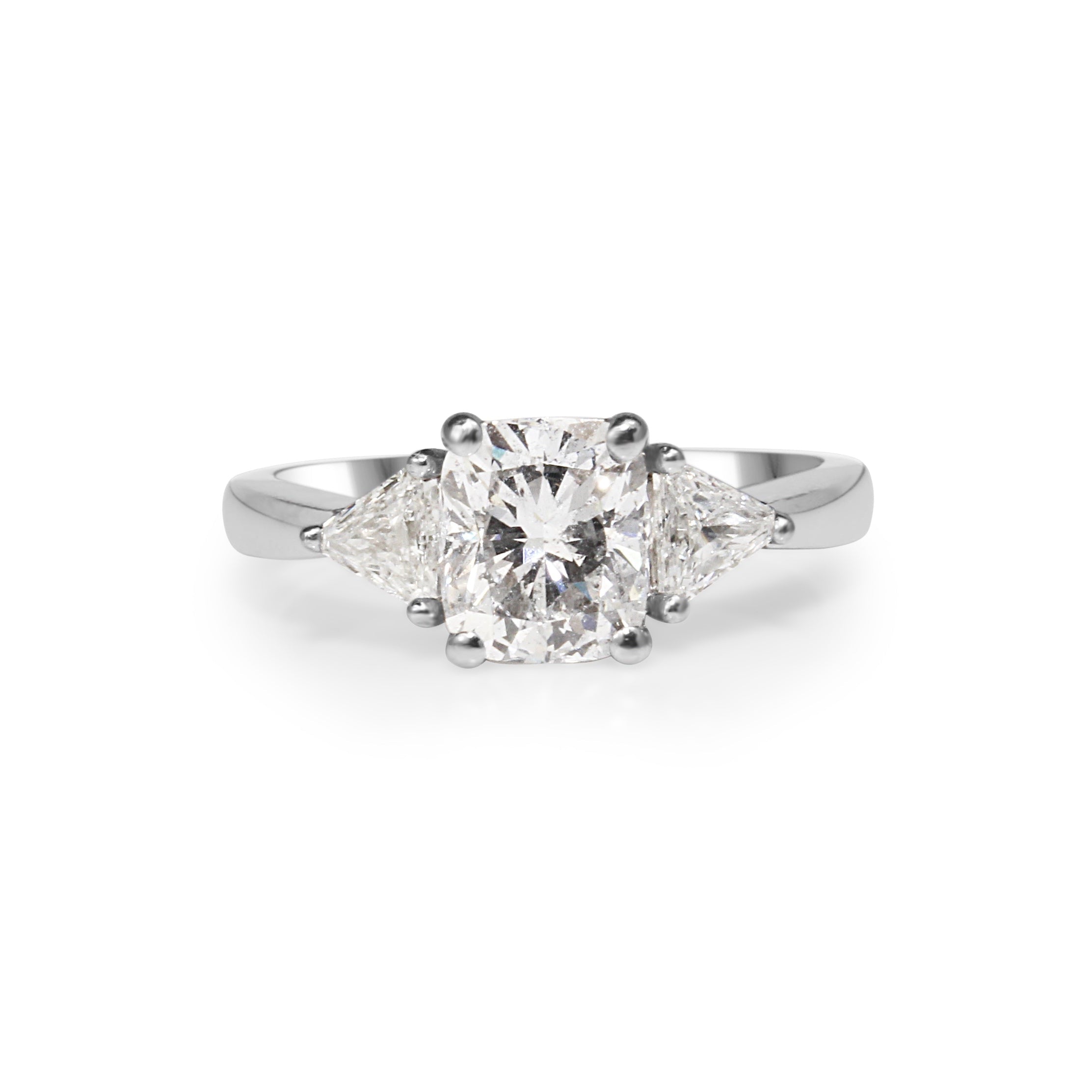 18ct white gold cushion and trillion cut diamond engagement ring