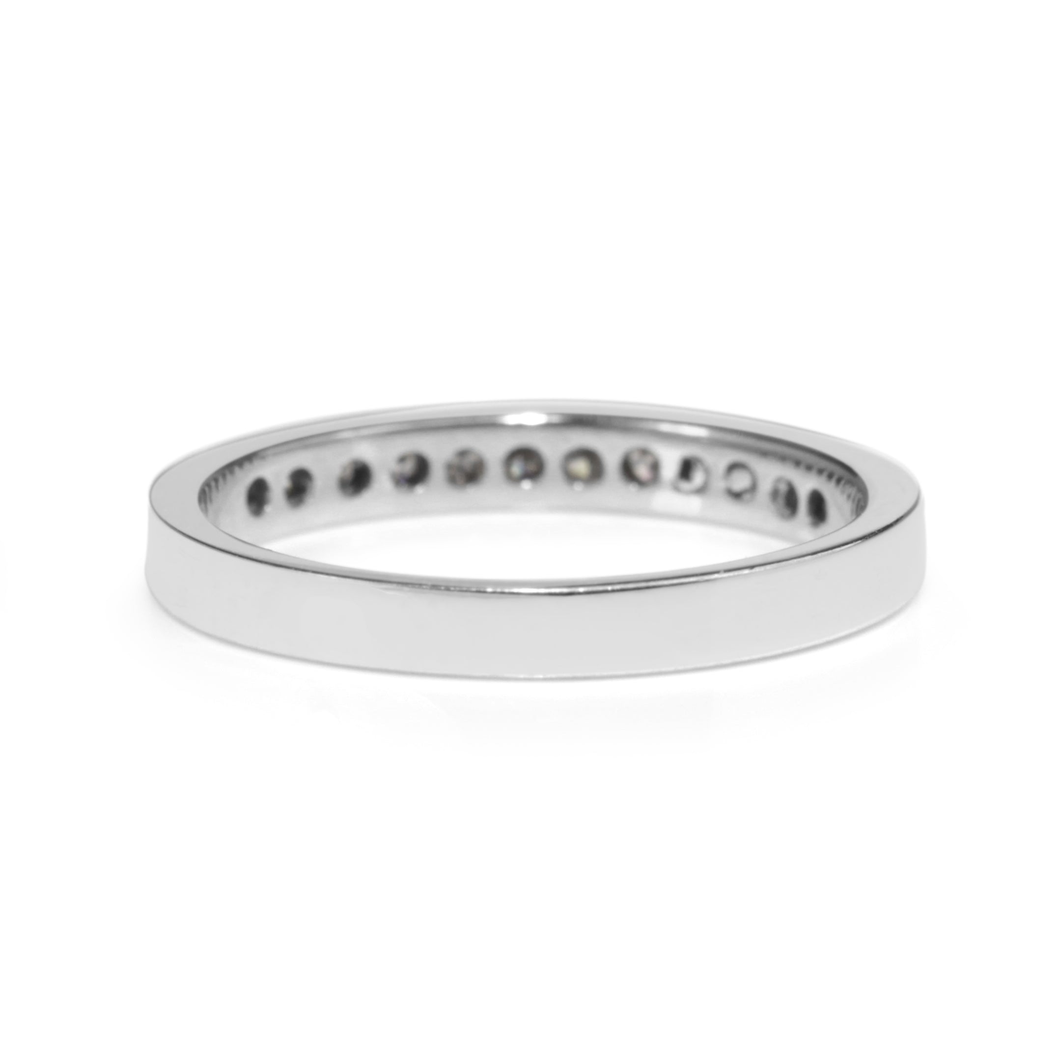 Rear view of 14ct white gold diamond band showing the plain band and channel settings