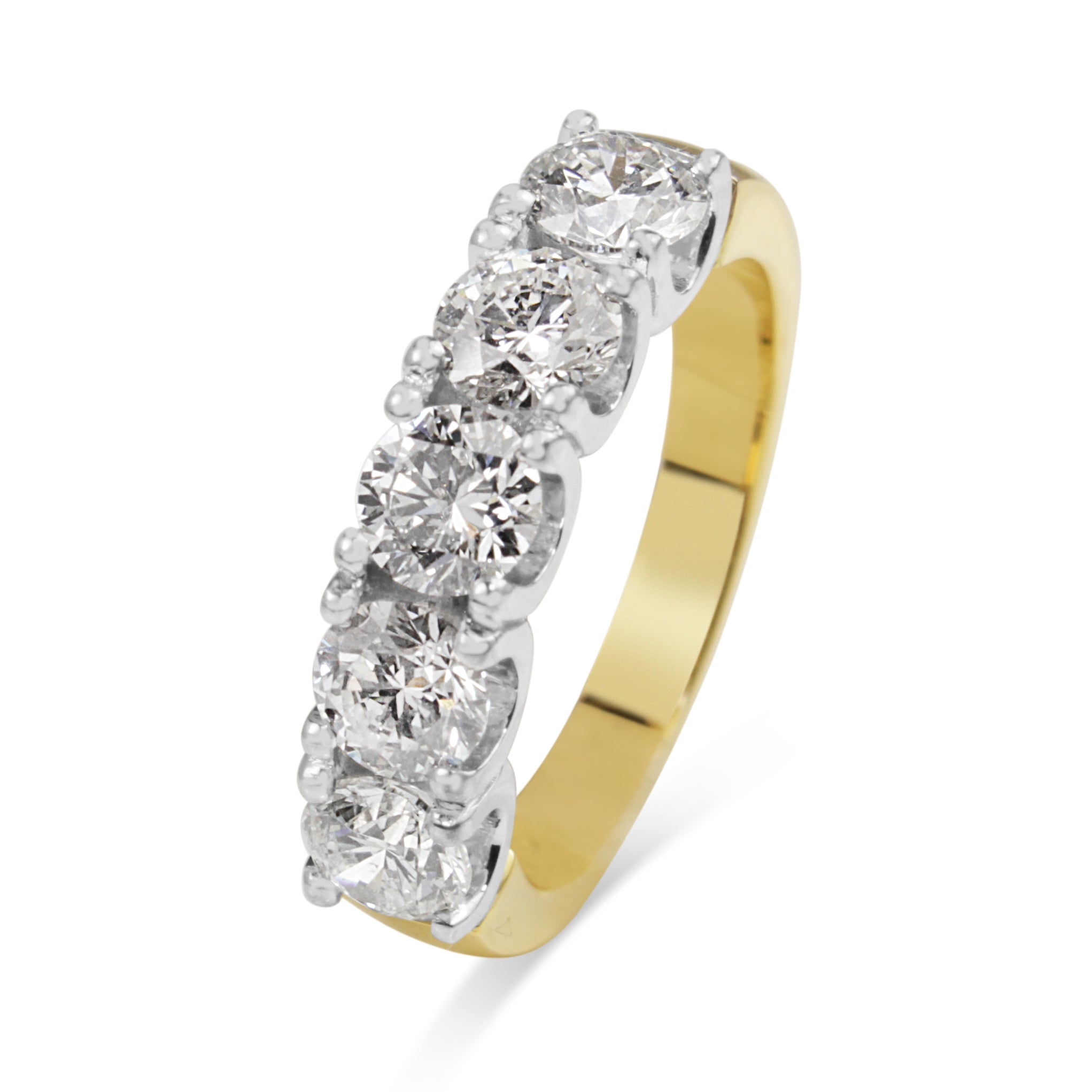 Close-up of five diamonds set in an 18ct yellow and white gold ring