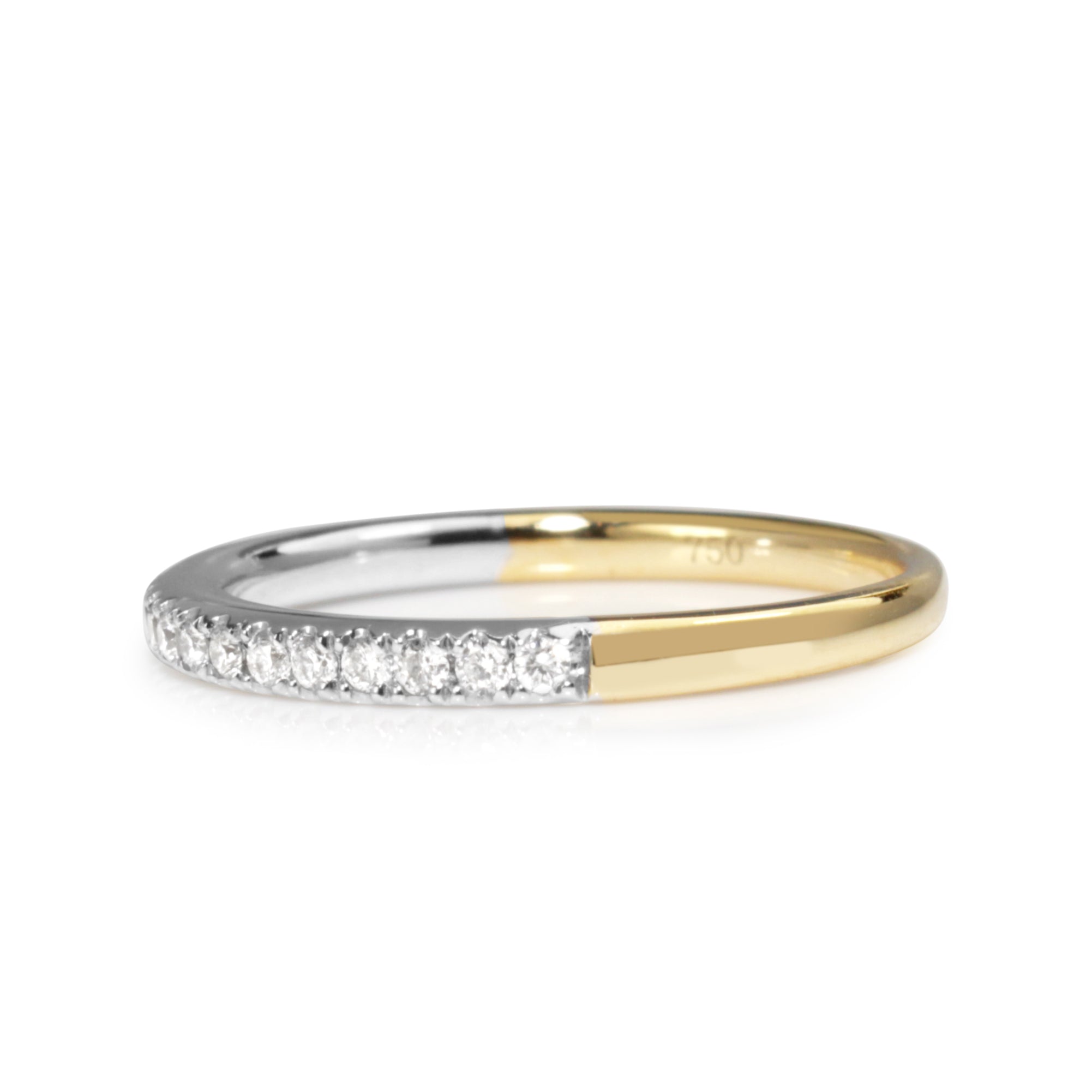 Side view of 18ct two tone diamond band showing the white gold diamond section and yellow gold band