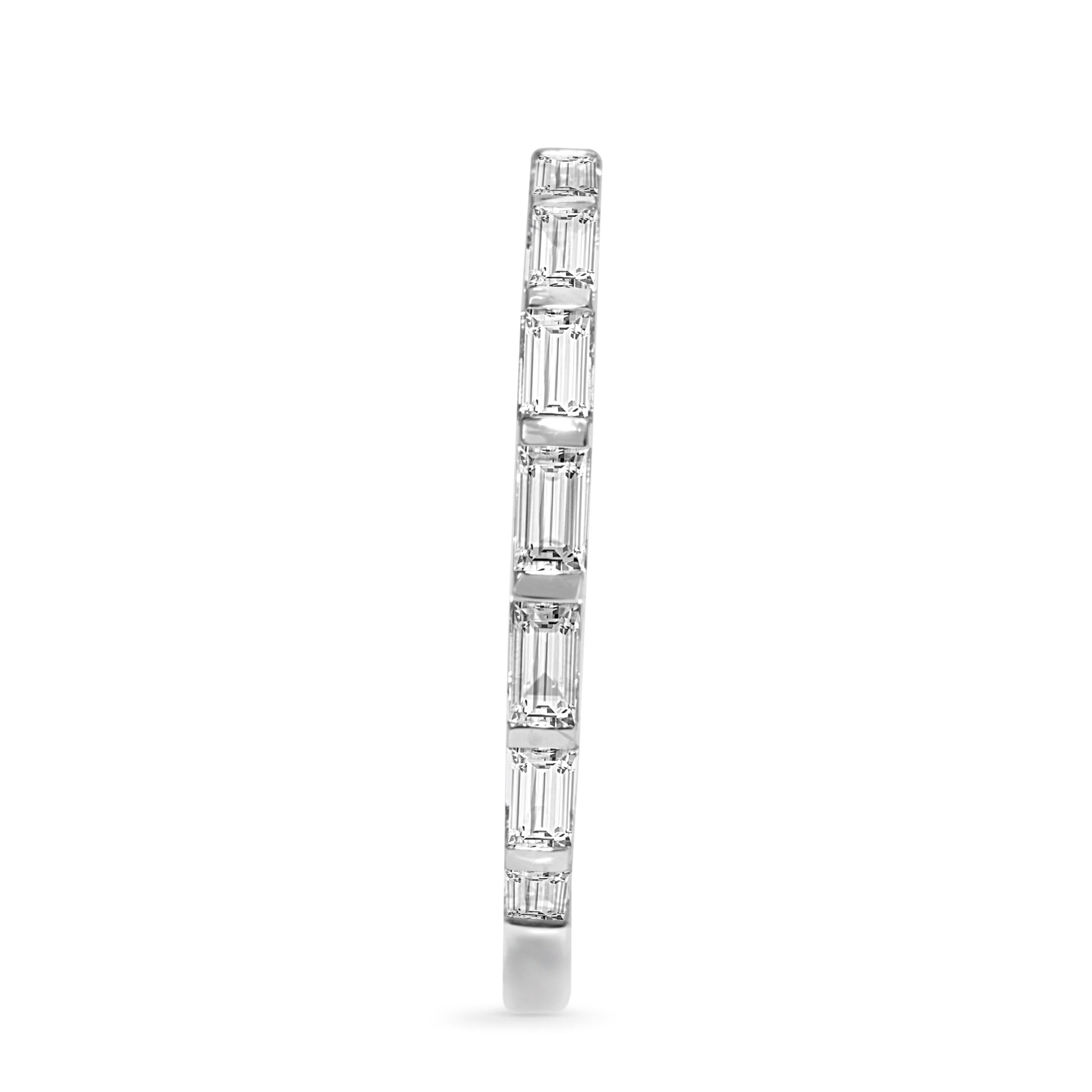 Angled profile of 18ct white gold baguette diamond band showing the diamond-set section and polished band