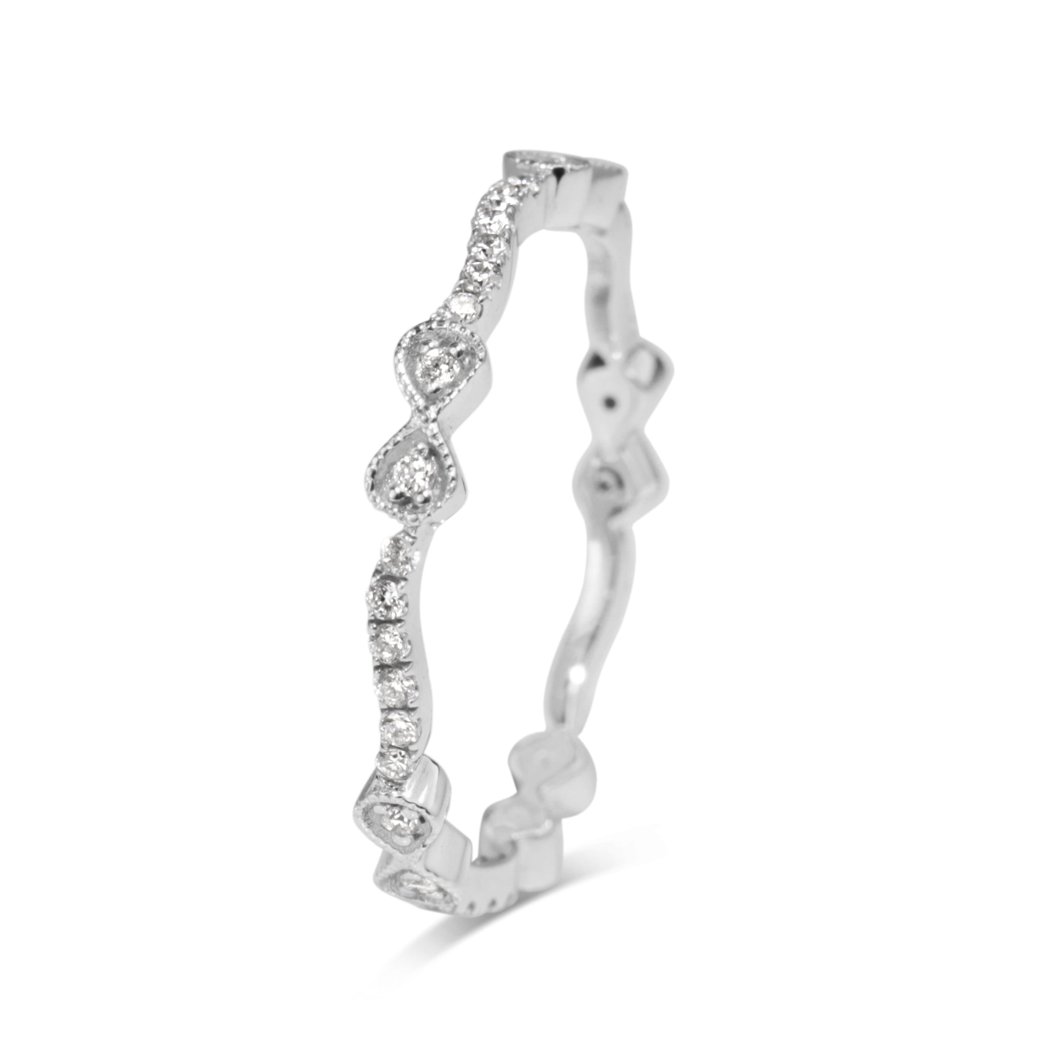 Profile view of 18ct white gold diamond bow band with repeating bow motifs