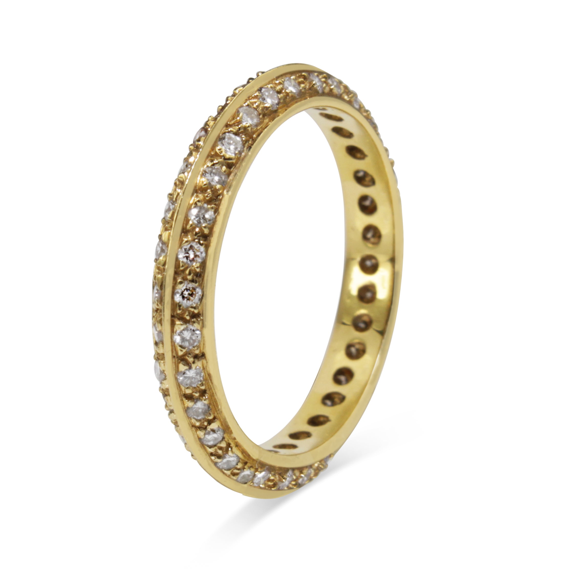 Angled view of 18ct yellow gold all round diamond band showing the raised knife edge profile