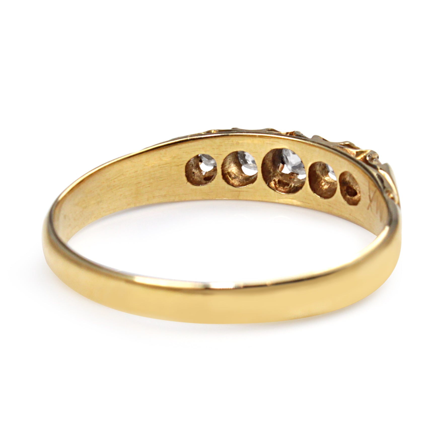 Side view of the 18ct yellow gold five stone old cut diamond ring