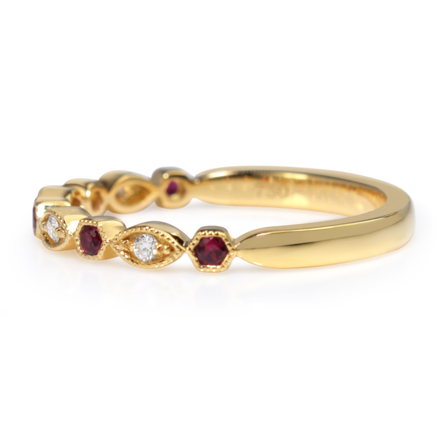 Angled view of 18ct yellow gold ruby and diamond vintage style band showing the alternating gemstone design
