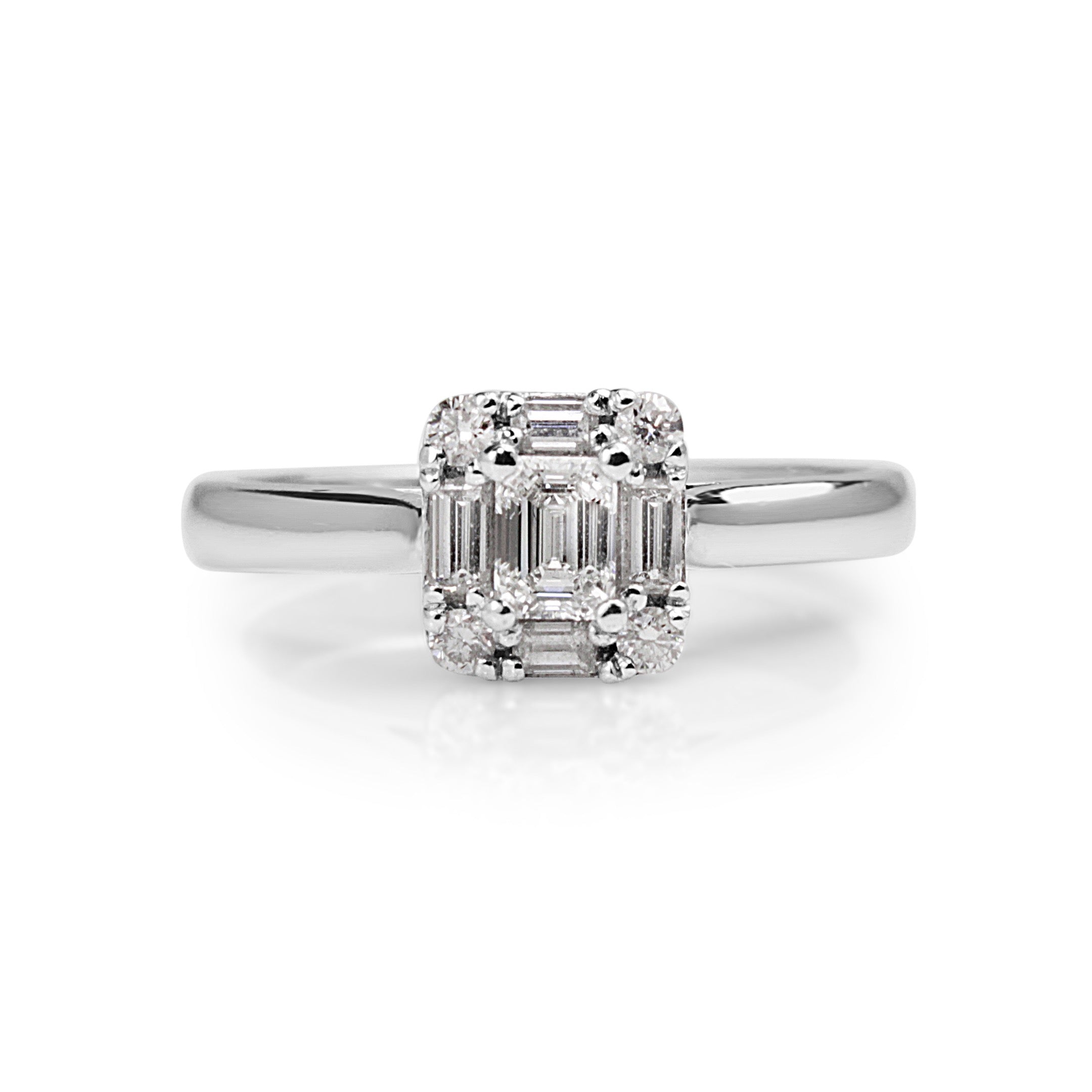18ct white gold emerald cut halo diamond engagement ring close‑up on hand