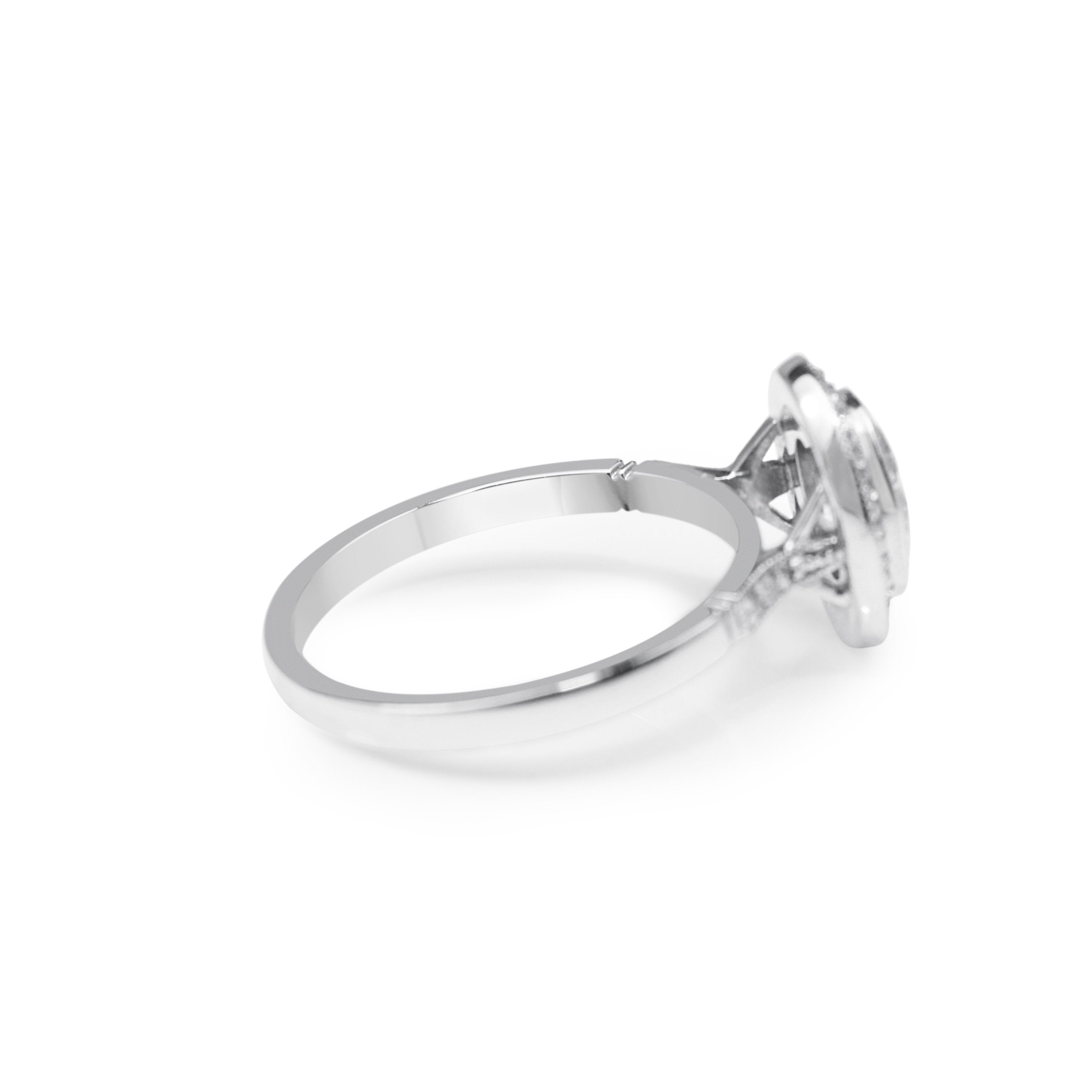 Oval Bezel Halo Diamond Ring