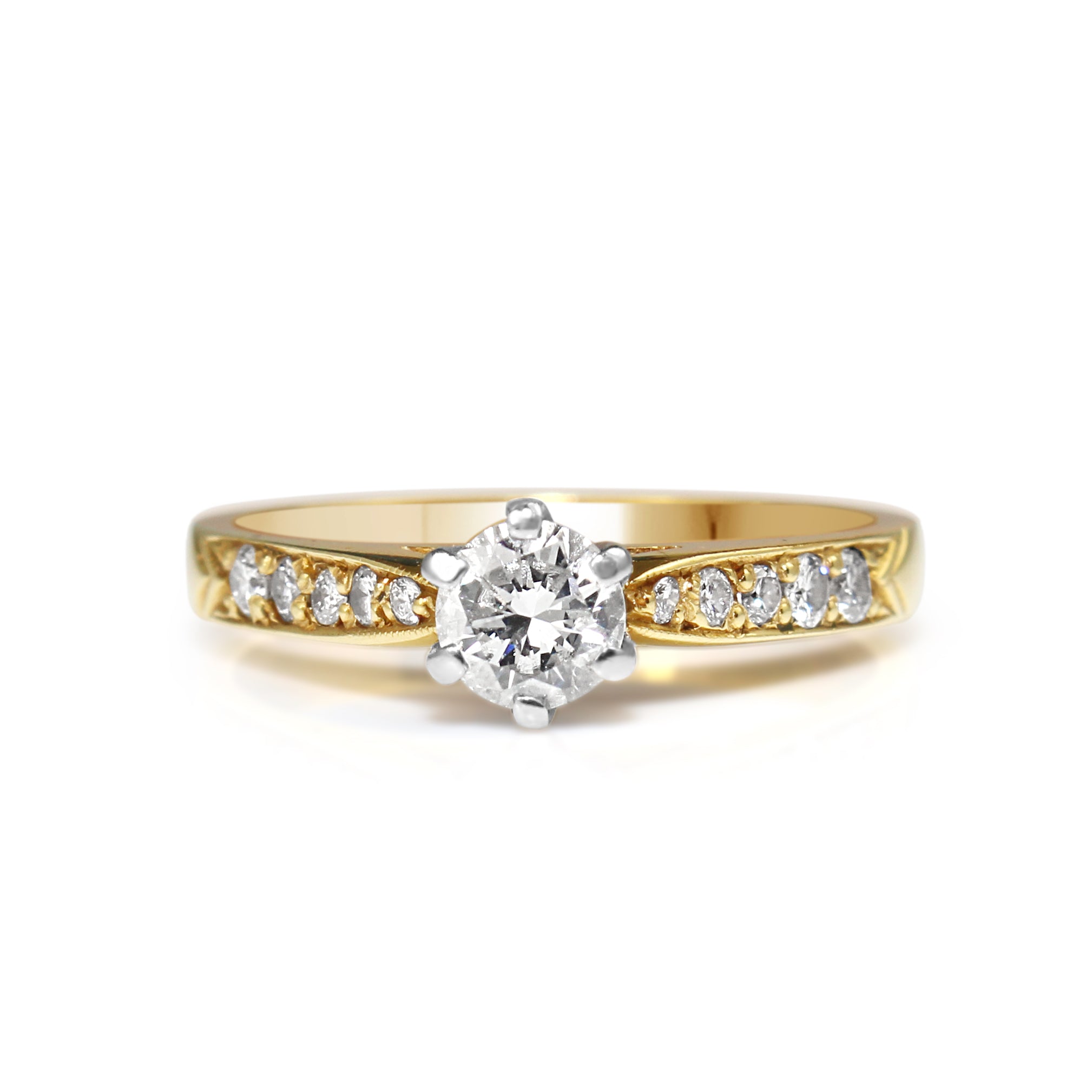 18ct yellow and white gold diamond solitaire engagement ring on white background