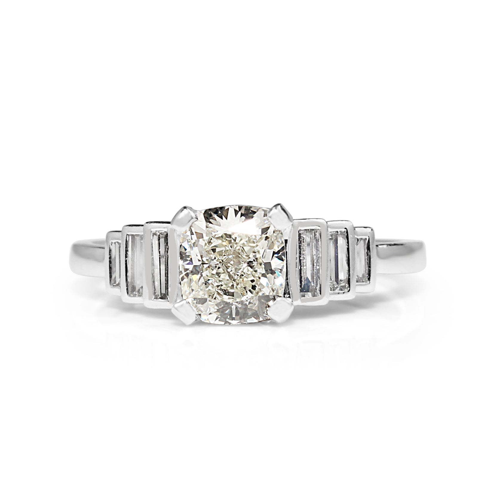 Platinum cushion cut diamond engagement ring close‑up