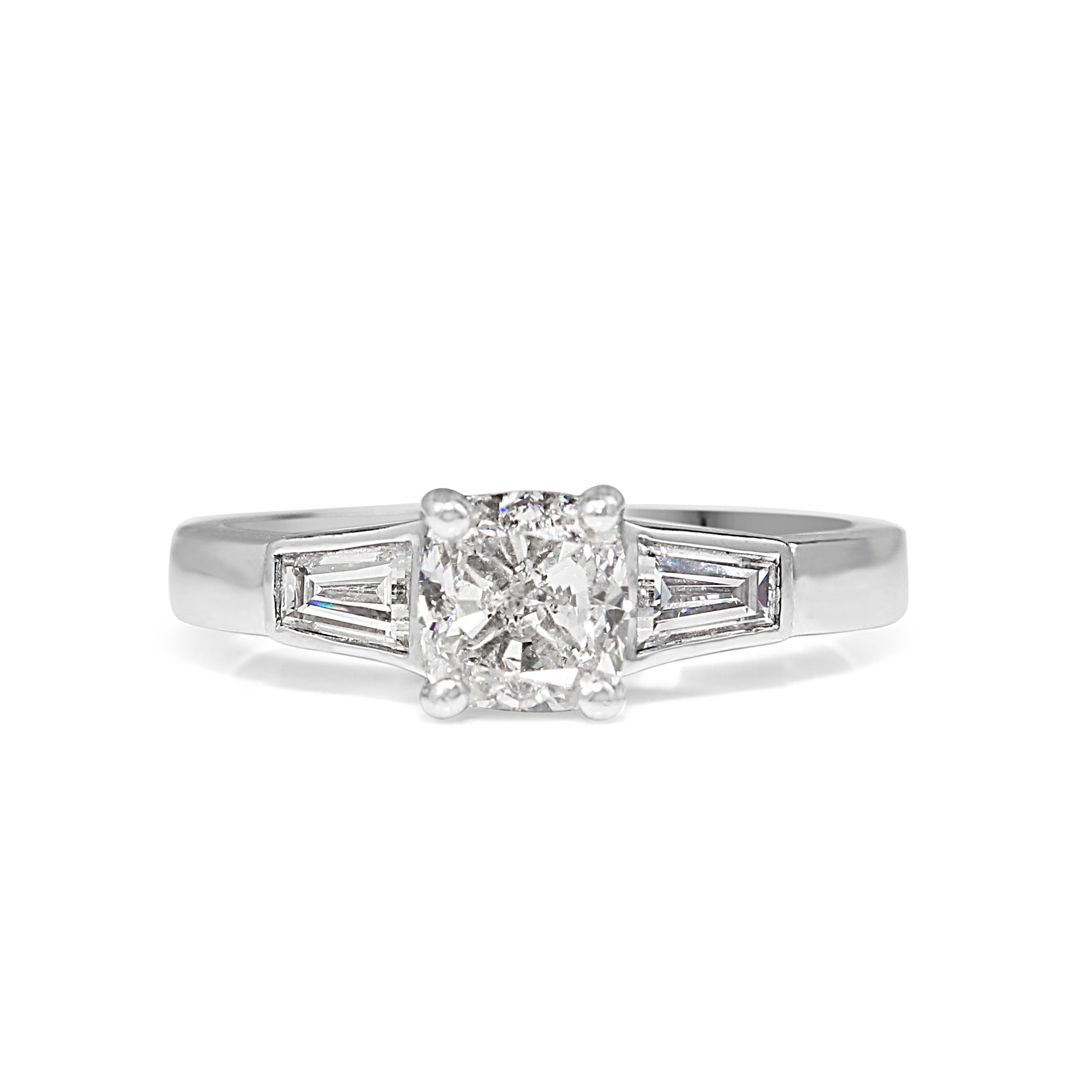 18ct white gold cushion cut 3‑stone diamond engagement ring on display – luxury diamond jewellery Australia