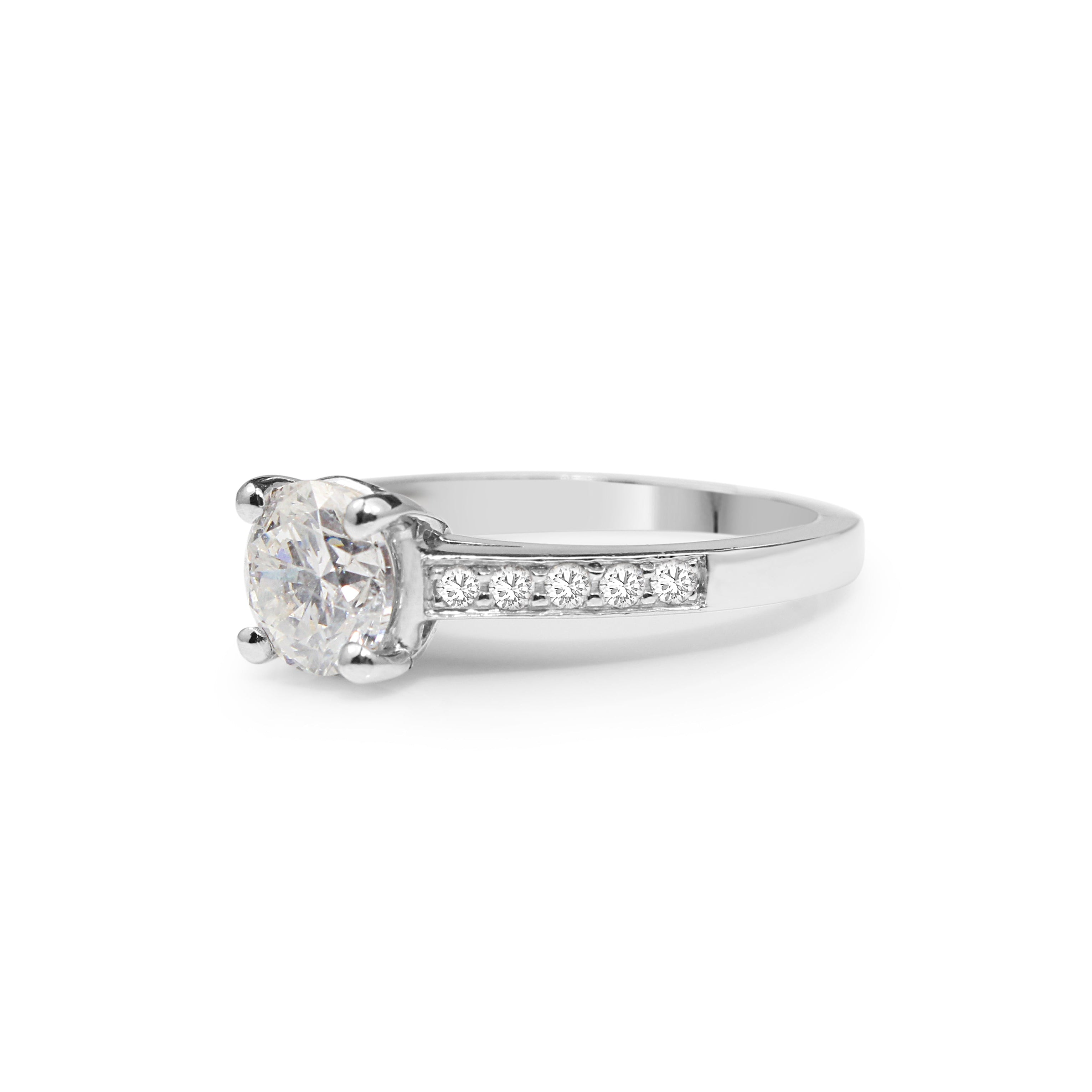 Elegant platinum solitaire diamond engagement ring worn on hand