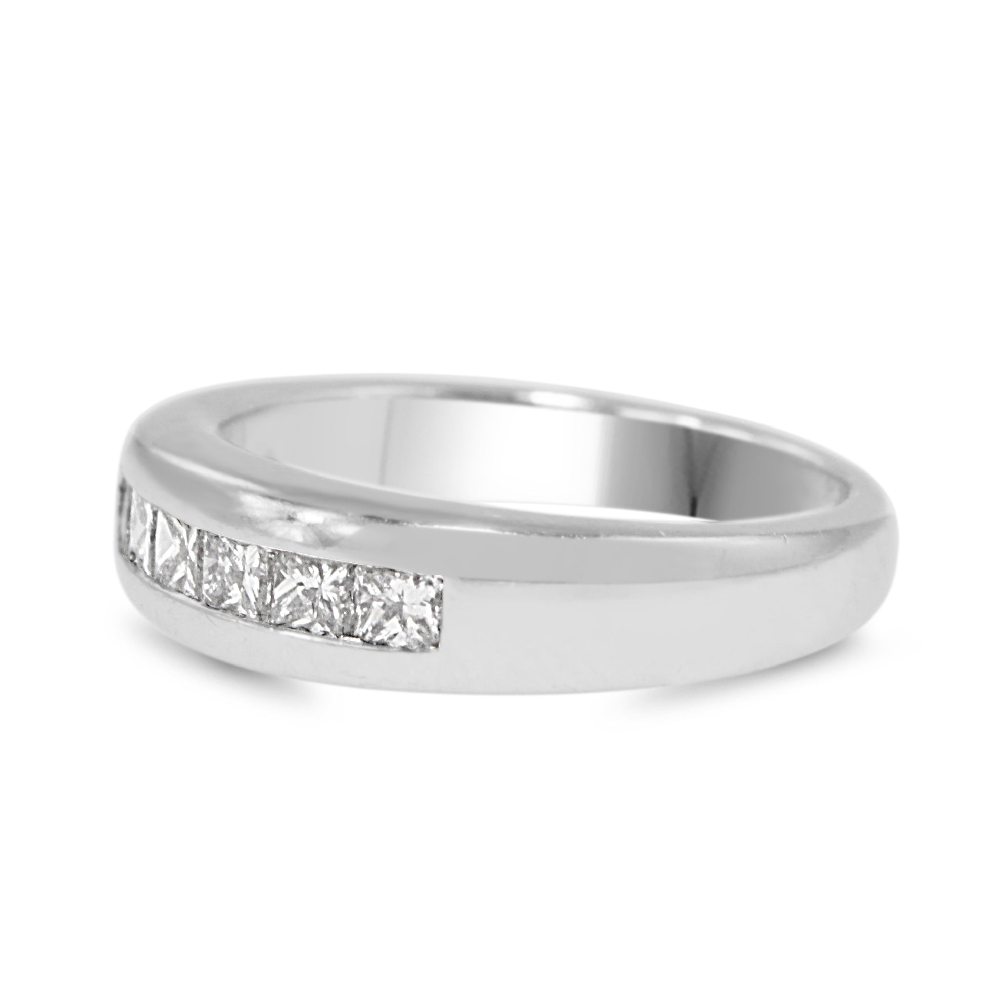Side view of thick platinum princess cut diamond wedding band