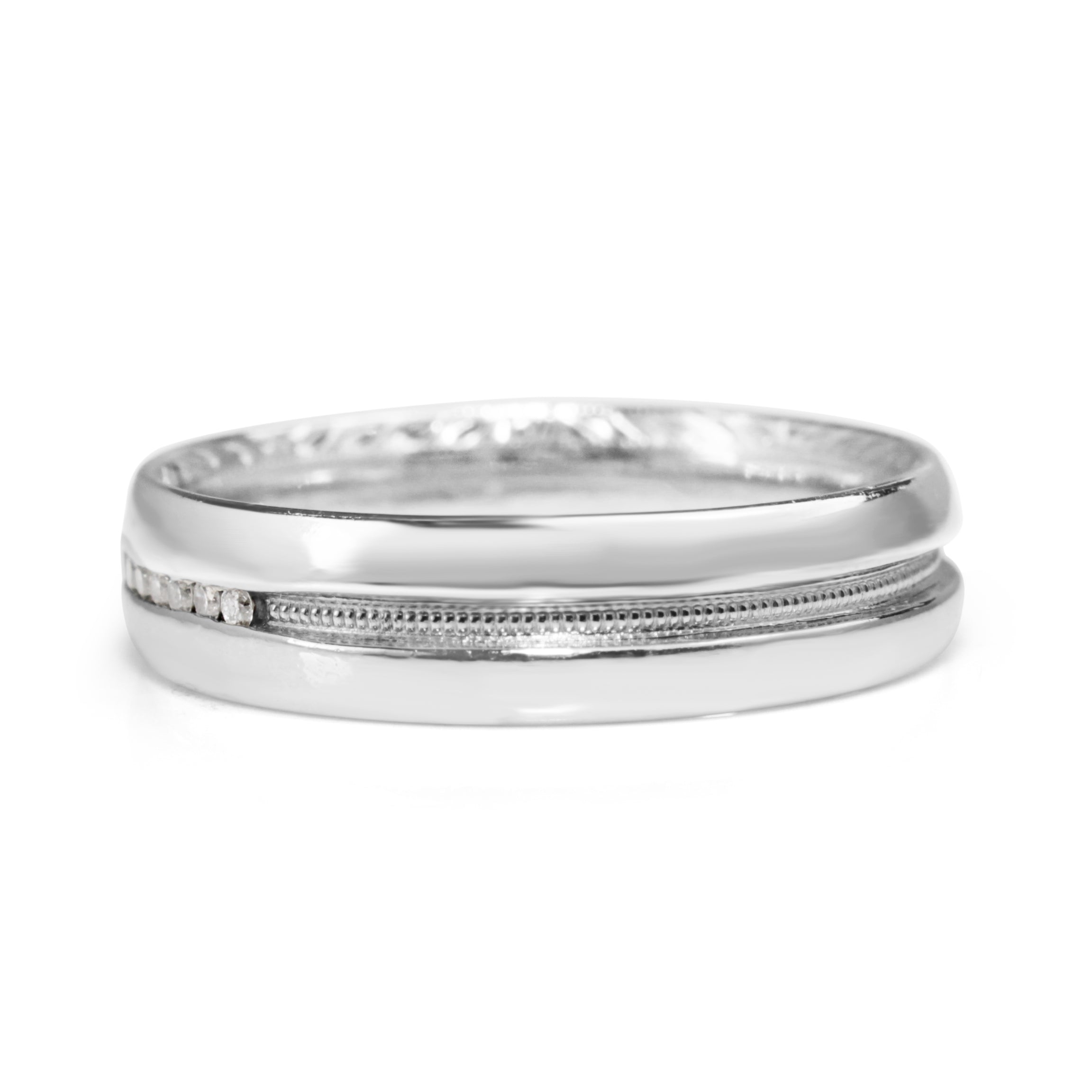 Vintage platinum diamond band showing detailed millgrain decoration around the centre