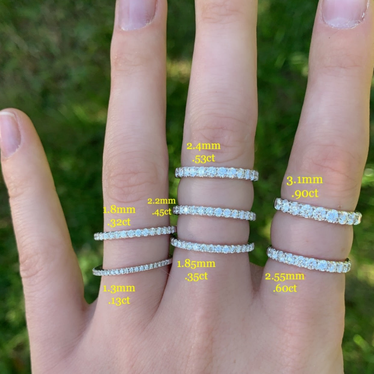 White gold diamond half hoop bands shown on hand for width and carat weight comparison, including the 3.1mm 0.90ct band