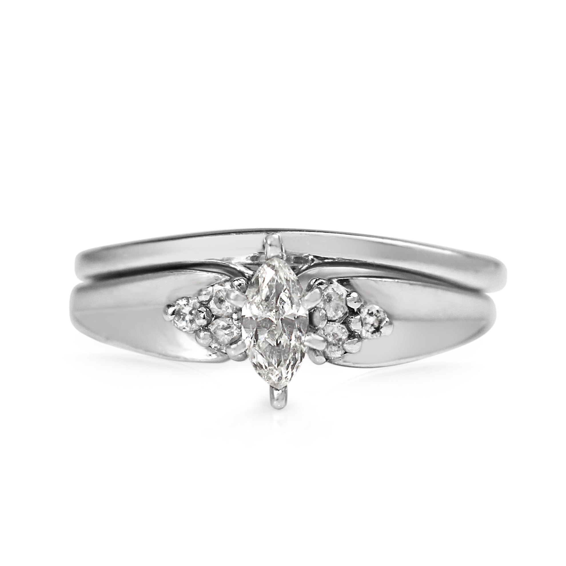 White gold marquise diamond ring with matching white gold band viewed from the front