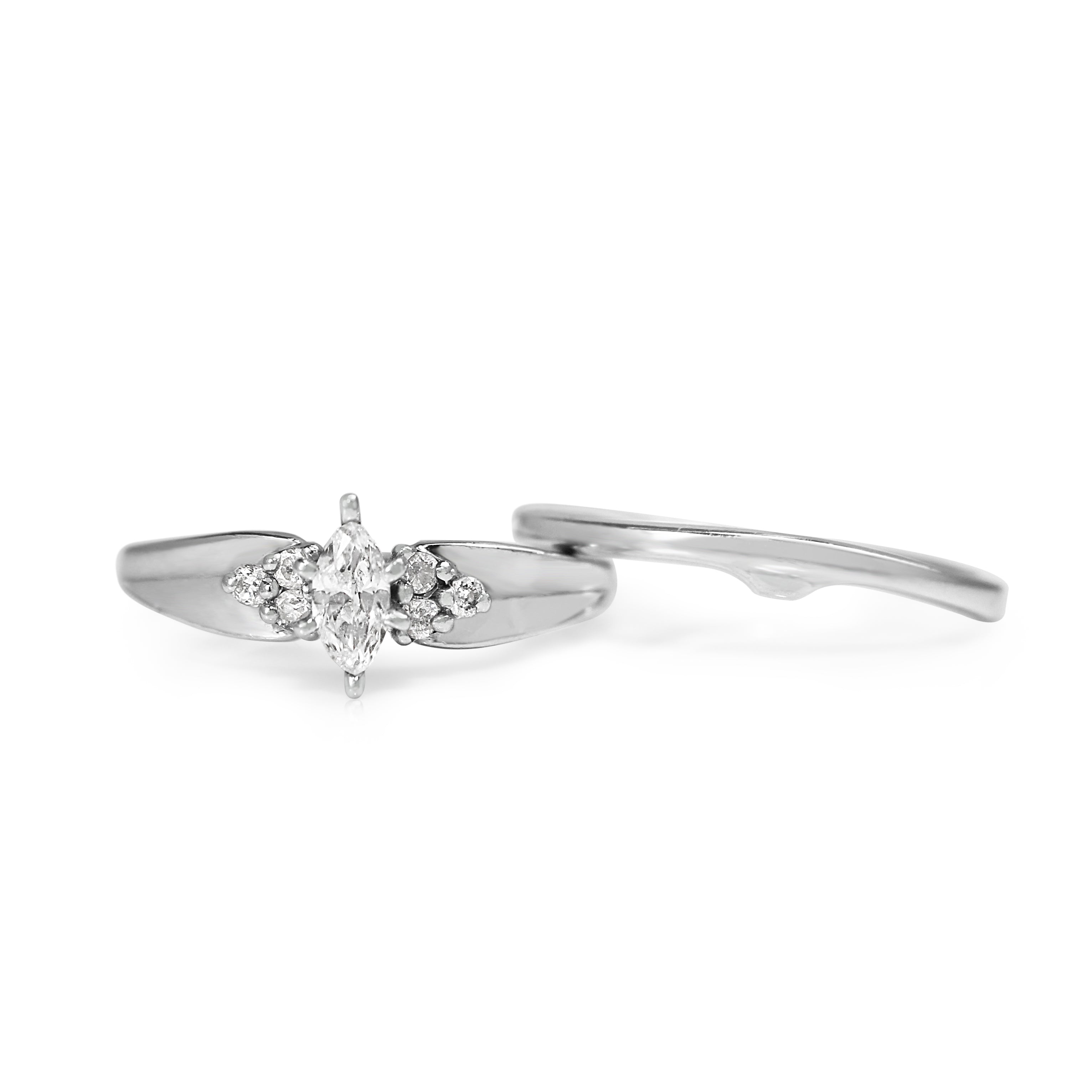 Profile view of the marquise diamond ring with its matching white gold band