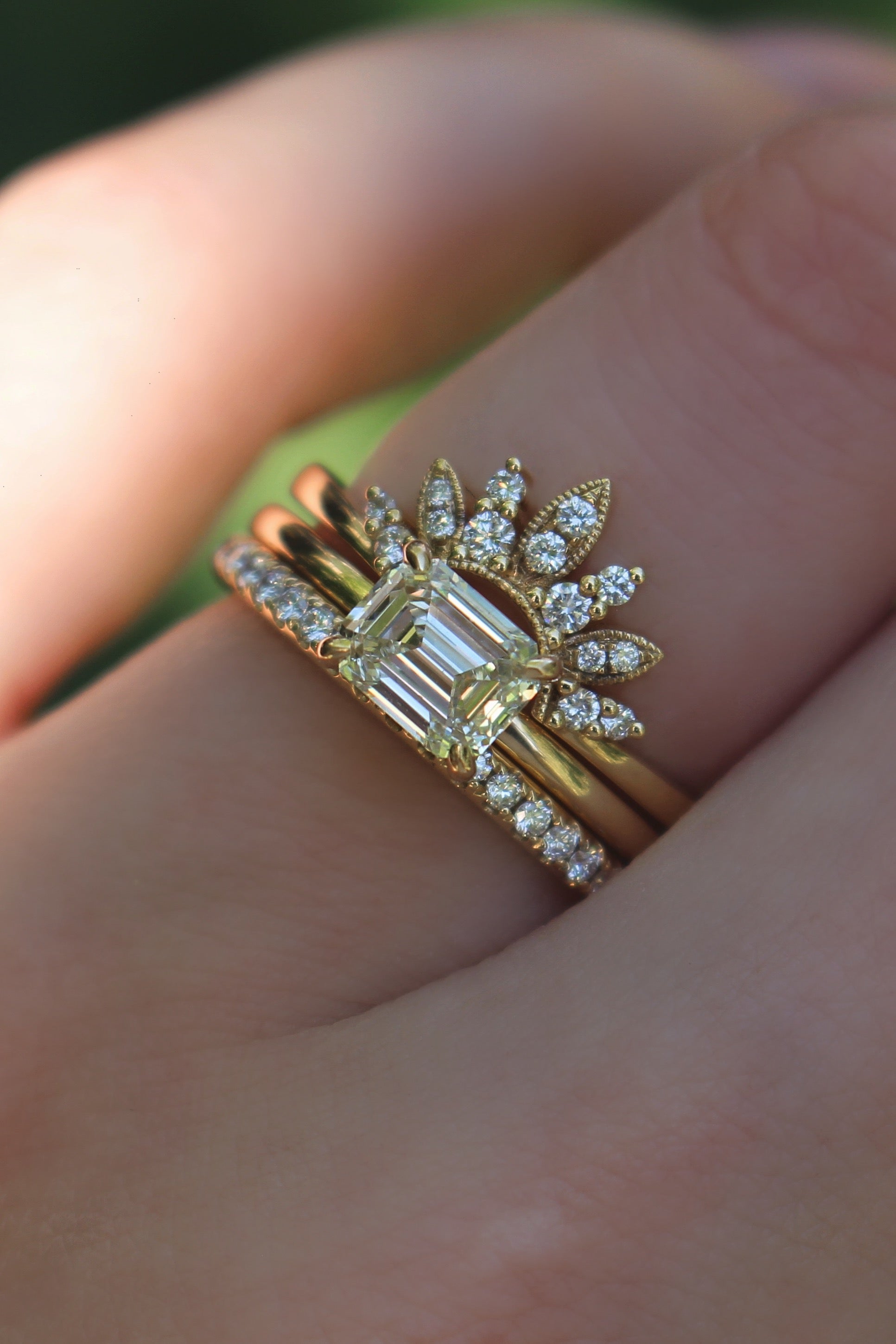 Yellow gold diamond band worn in a stacked ring combination